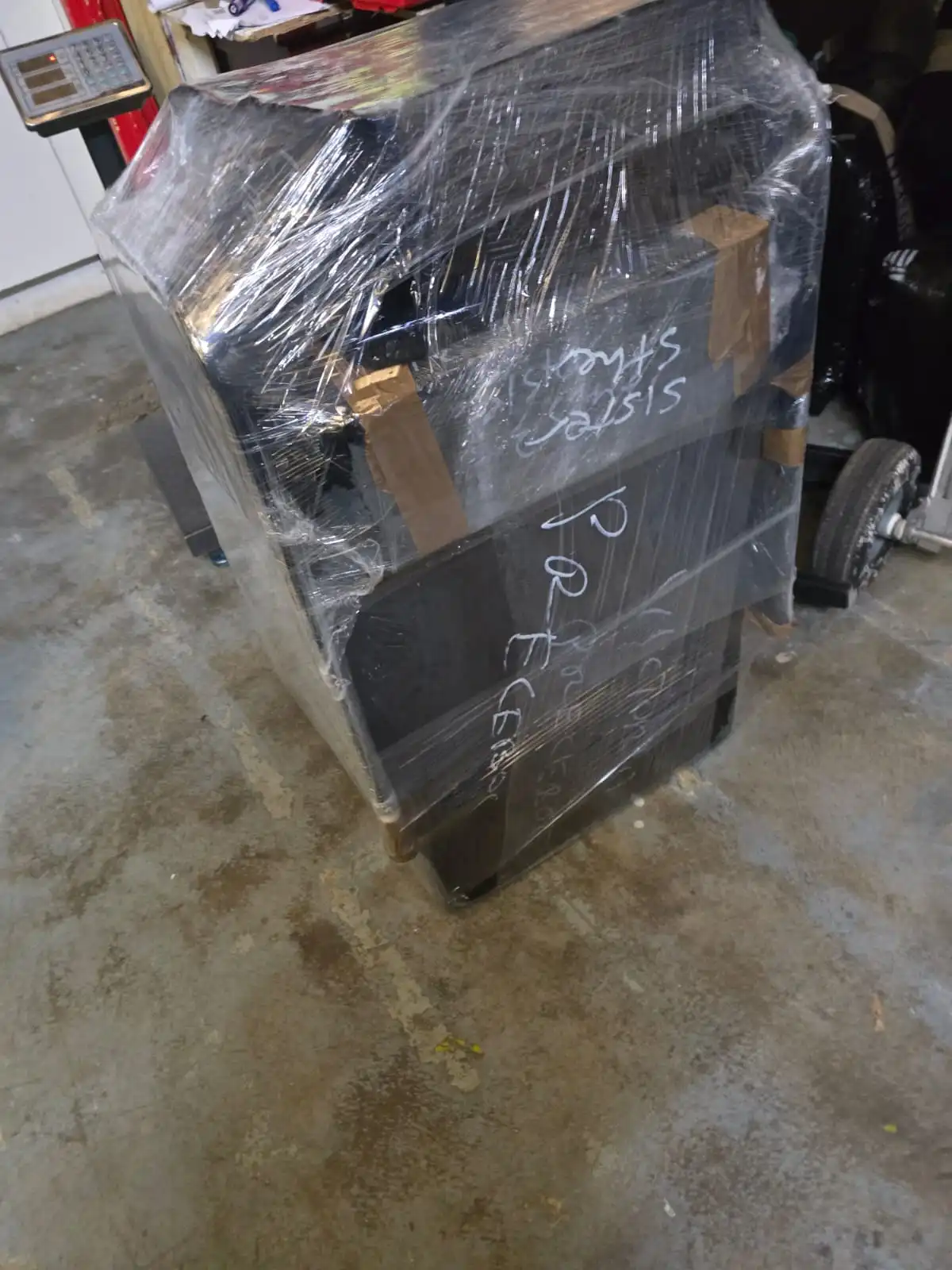Customer goods wrapped and weighed, ready for air freight to Nigeria