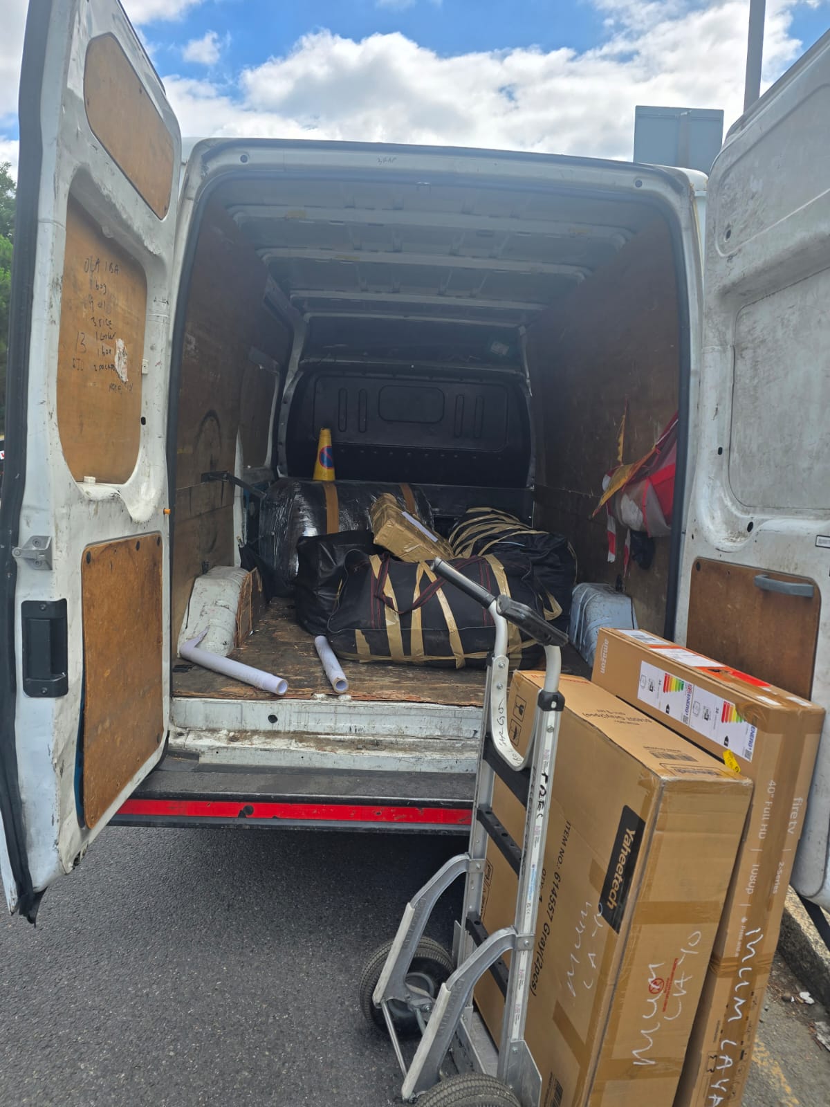 Precebol transit van being loaded with customer cargo for Nigeria shipment