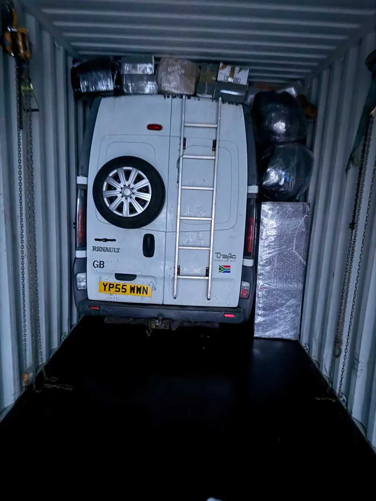 Precebol transit van being loaded into 40ft container for Nigeria cargo shipping